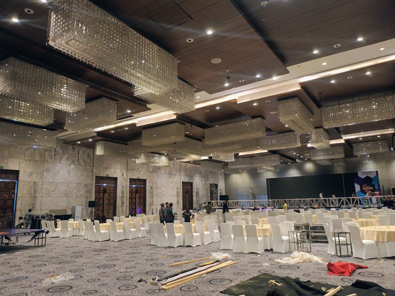 High-end corporate event hall with stage and lighting